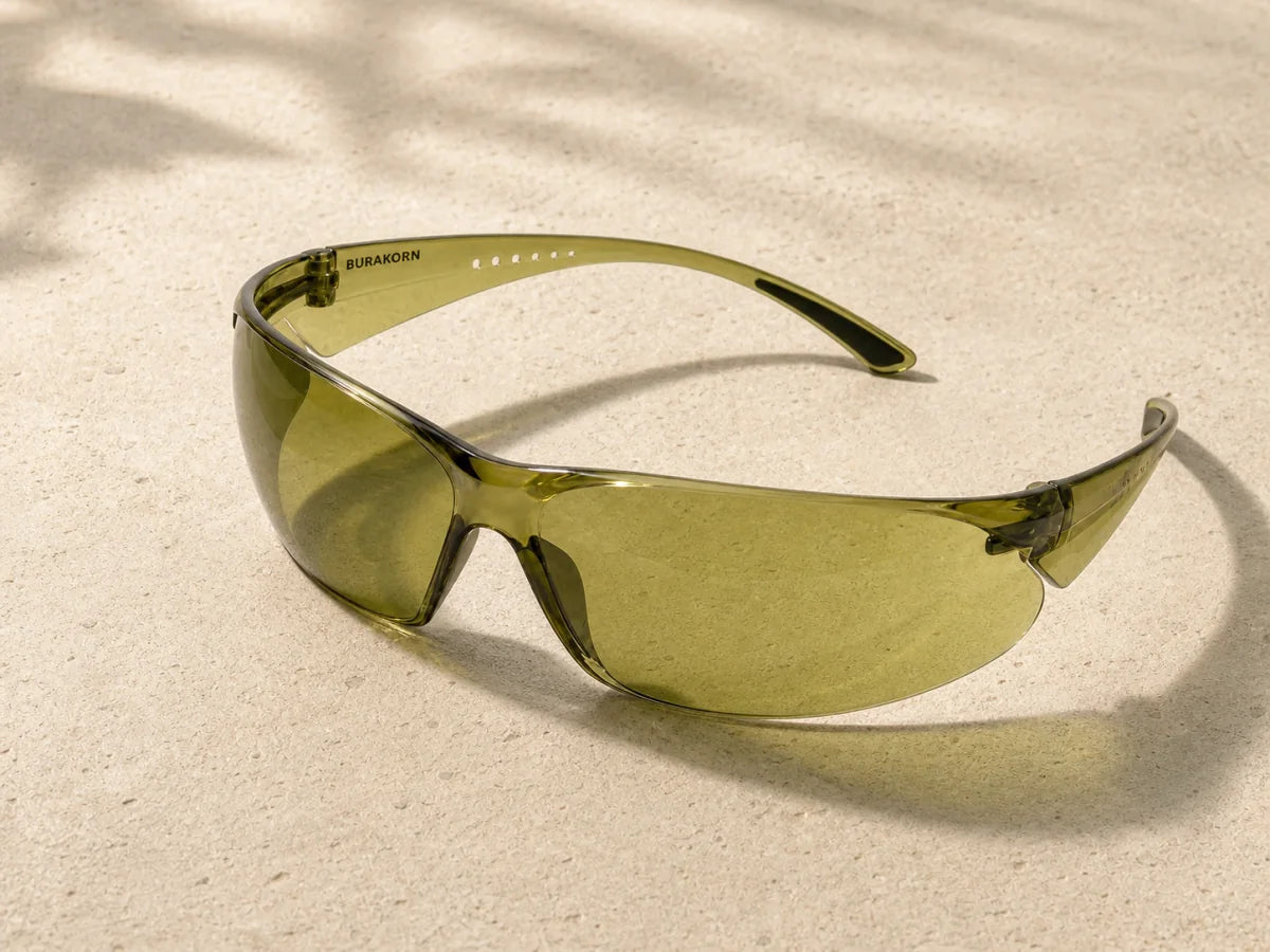 B-Sentinel 430 olive eyewear in daylight on warm stone